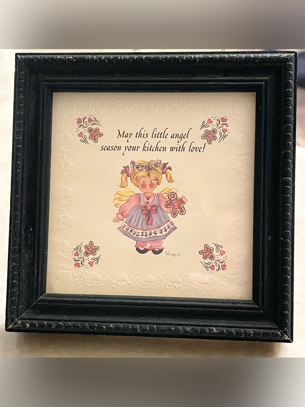 Small, framed Angel picture for kitchen